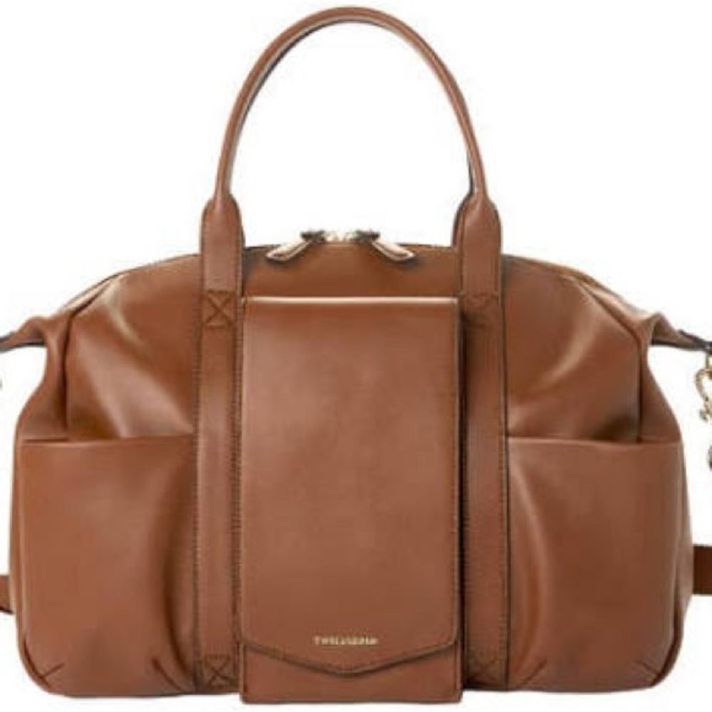 Twelve little Tan diaper bag. Like new condition at a fraction of the price.